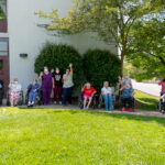 residents and staff wave to the Sundale Memorial Day parade